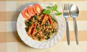 Rice topped with stir-fried pork and basil.